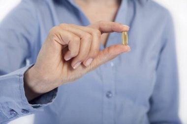 bir kadın bir kapsül, yüzü fotoğraf tutar