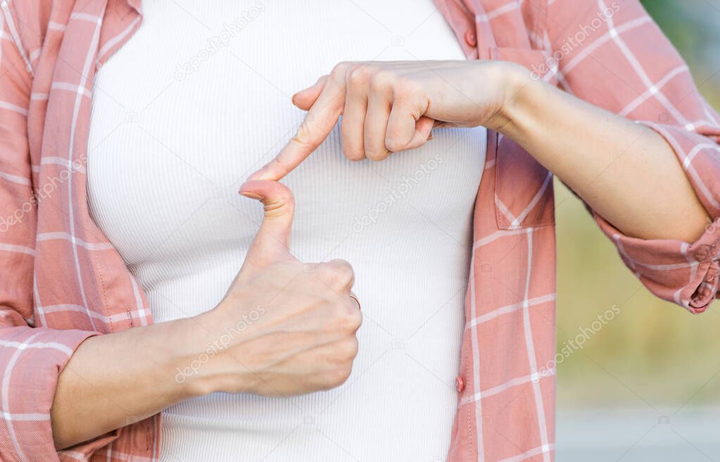 woman showing thumb up. hand with hyper flexible thumbs