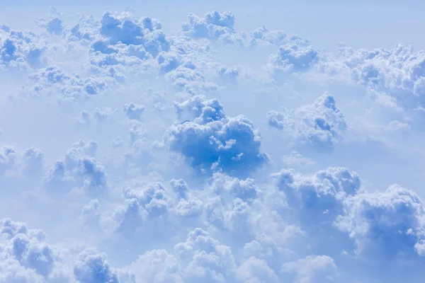 White cloud clusters in blue sky and sunshine are beautiful scenery. Use as for illustrations and background images.