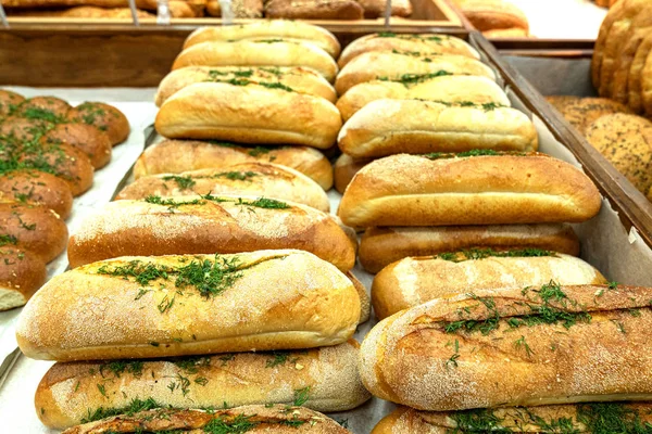 freshly baked baguettes on the counter in the bakery shop