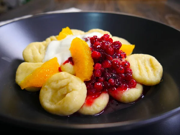 Beautiful food on plate. Lazy dumplings and Fruits. Cottage Cheese Gnocchi. Vareniki.