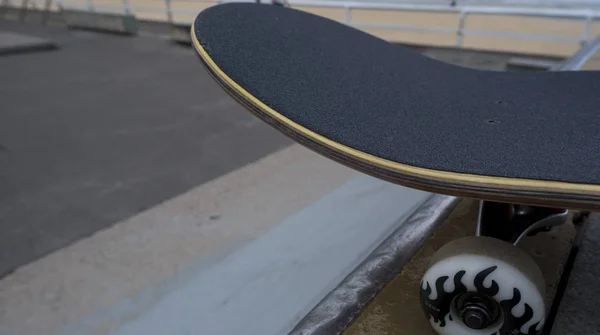 Skateboard on top of ramp