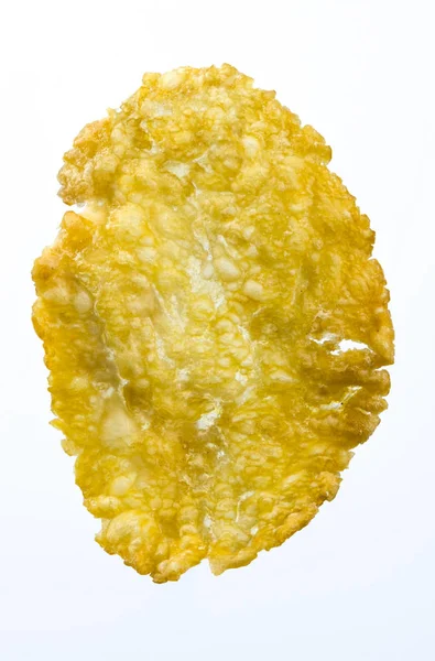 Imagem macro de milho em flocos contra fundo branco — Fotografia de Stock