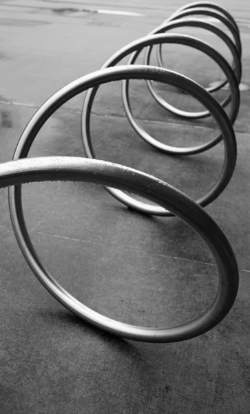 Black and white image of a spiral bicycle rack