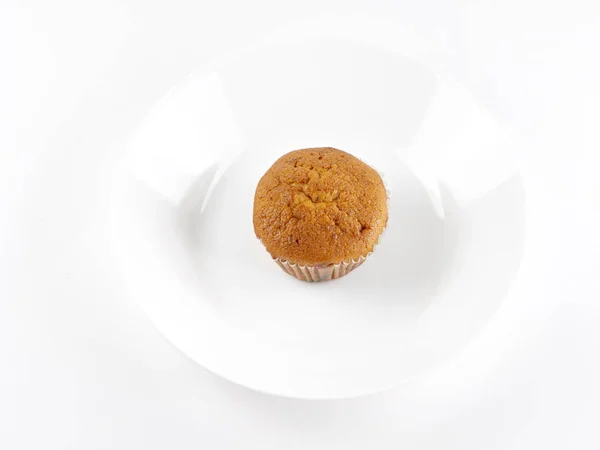 Banana cake is on the plate on white background. Top view — Stock Photo, Image