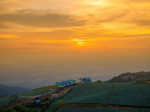 The sun is setting at the village on the hill. Sunset view, Birds eye view photo of Phu tub berk Phetchabun Mountains in Thailand, Mountain landscape