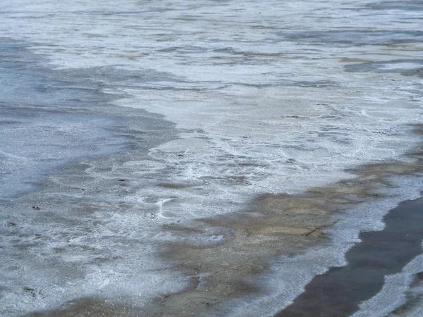 sea water prepared in the salt field to let it dry from sun and become white sea salt in the field of Samut Songkram, Thailand, Fleur de Sel in Sea salt fields, salt-pond, salt-farm