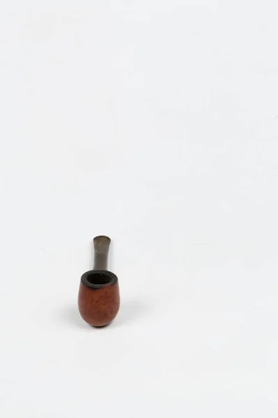 tobacco pipe accessory made of wood on white background