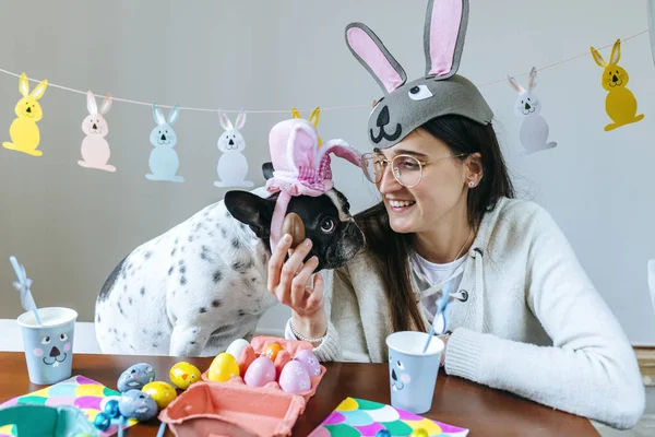 Woman with dog celebrating easter