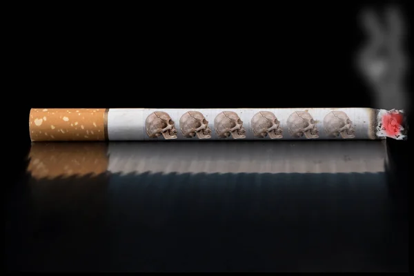 Burning cigarette with smoke on black background — Stock Photo, Image