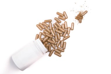 beyaz şişeden ot kapsülü