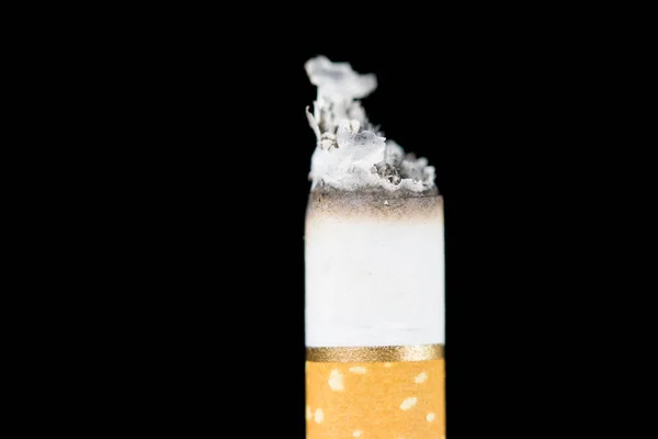 Smoking cigarette on black background — Stock Photo, Image