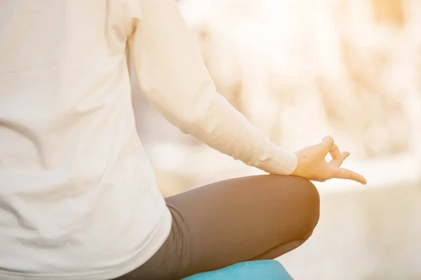 close up of yoga meditating in nature.