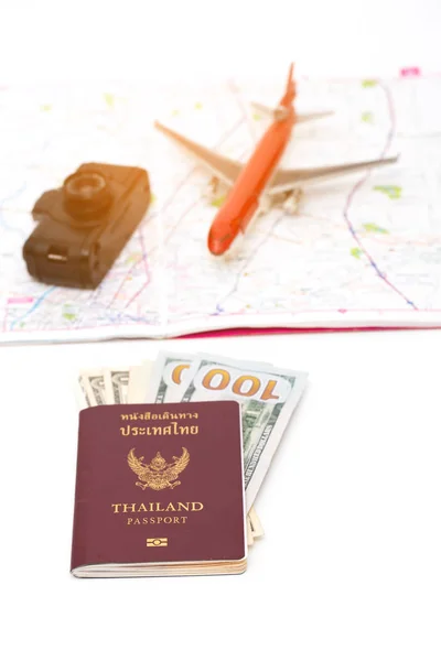 Passport ,map ,camera and mini airplane . traveler concept