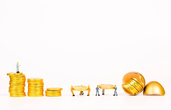 Miniature people working with gold egg — Stock Photo, Image
