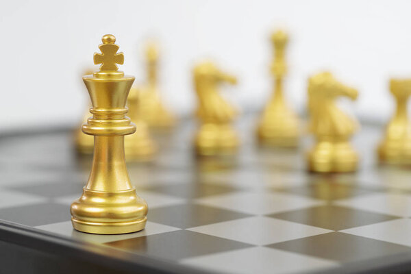 Close up golden chess pieces on chessboard 