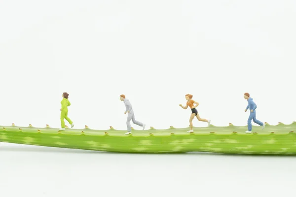 Personas en miniatura corriendo — Foto de Stock