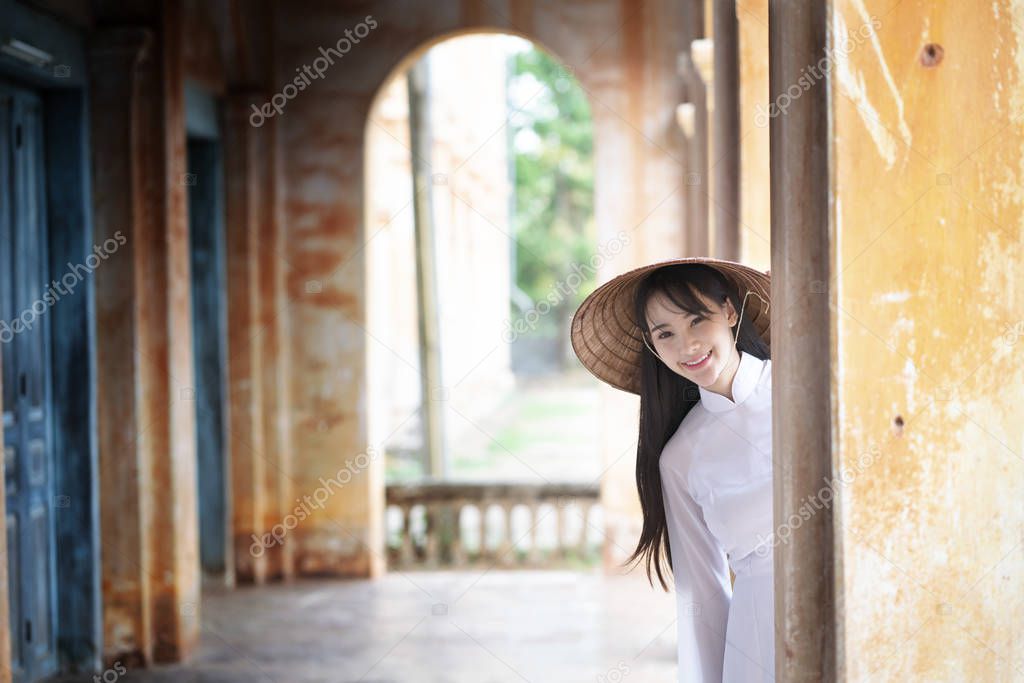 Beautiful woman with Vietnam culture traditional dress, Ao dai, 