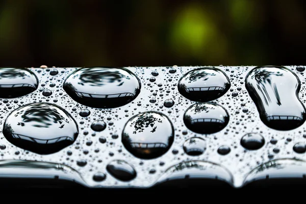 Amazing shape of rain drop on steel surface after rainy day, water drops make abstract nature texture