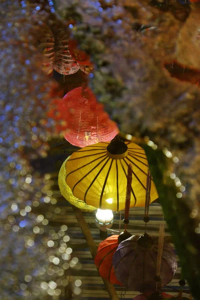 Lanterns reflect on surface water make lantern background with amazing bokeh lights