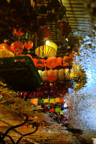 Lanterns reflect on surface water make lantern background with amazing bokeh lights