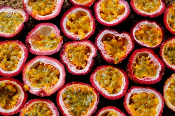 Top view passion fruits cut in half background — Stock Photo, Image