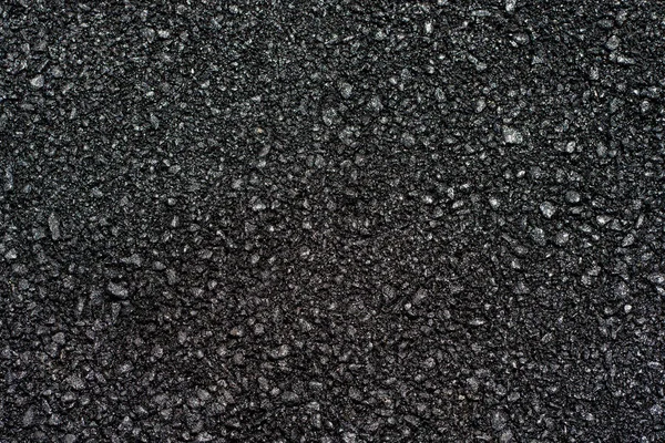 Textura do asfalto na luz do dia ensolarado — Fotografia de Stock