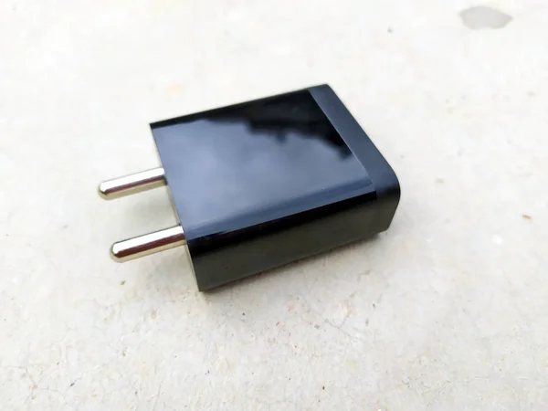 image of black fast mobile charger on the road