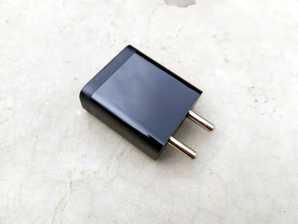 image of black fast mobile charger on the road