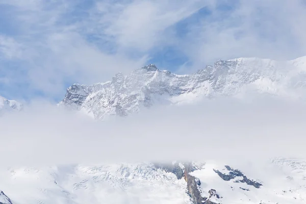 Scenic view on snowy mountains in cloudy day, view on snowy Matterhorn, Zermatt, Switzerland