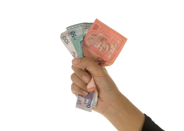 stock image A female hand holding money against a white background