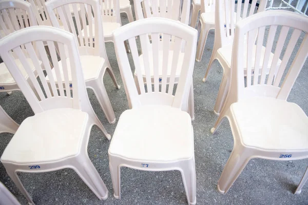 No body on plastic white chairs pattern — Stock Photo, Image