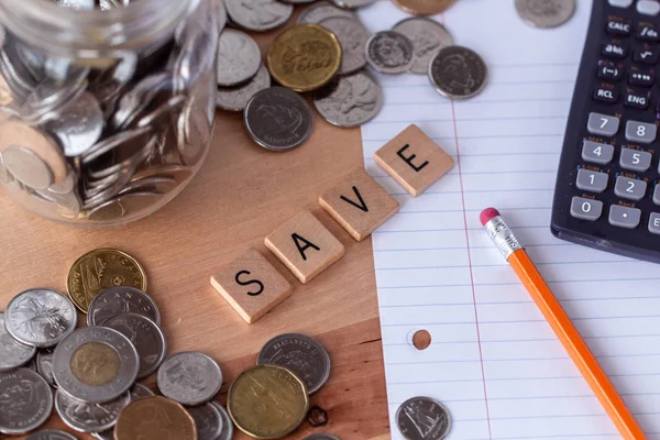 Spelled Out Wooden Letter Tiles Money Pencil Paper Calculator Surrounding — Stock Photo, Image