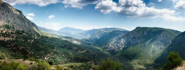 Scenic mountain landscape against sky, Delphi, Greece clipart