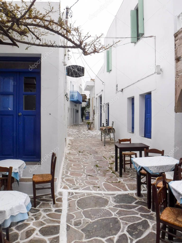 Empty outdoor cafe in Milos island, Greece