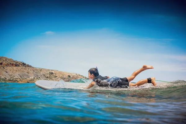 Boy riding on the sea wave, Greece — Stock Photo, Image