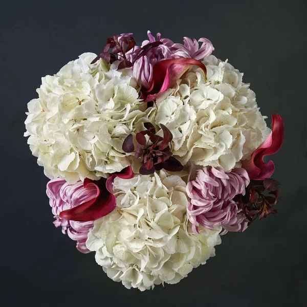 Bouquet of white hydrangea, red calla and pink chrysanthemum. Stock Picture