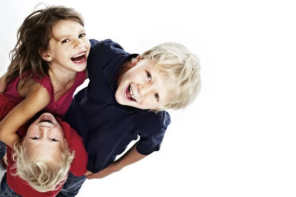 Group Laughing Children Hugging Each Other Looking Isolated White Background Royalty Free Stock Photos
