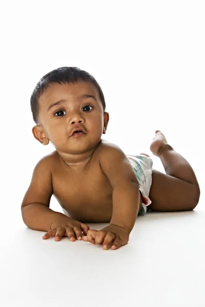 Adorable Indian Baby Lying Floor Looking Straigth Isolated White Background — Stock Photo, Image
