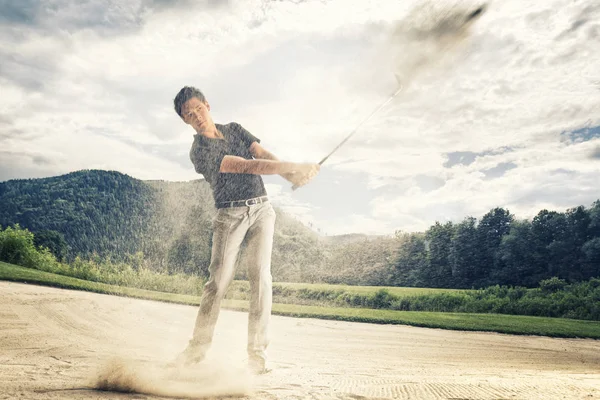 Male Golf Player Blue Shirt Grey Pants Hitting Golf Ball — Stock Photo, Image