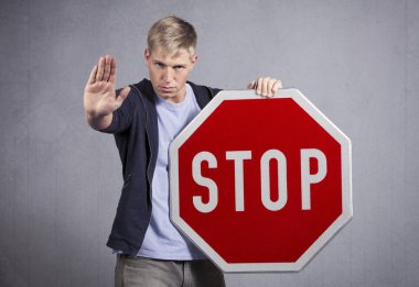 Man showing stop sign. clipart