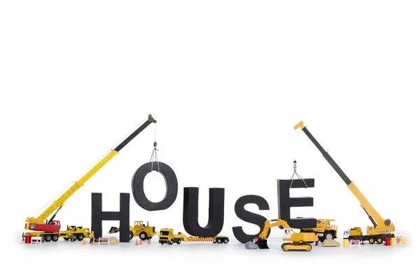 Dom w budowie: Maszyny budowlane dom-słowo. — Zdjęcie stockowe