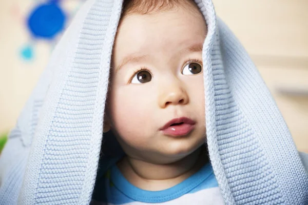 Sweet baby boy with blue blanket. — Stock Photo, Image