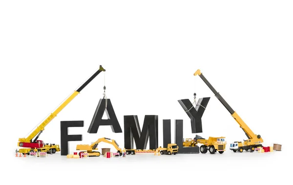 Establish a family: Machines building family-word. — Stock Photo, Image