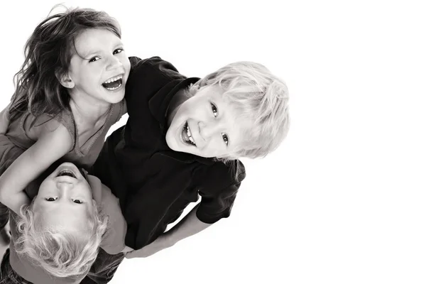 Happy children laughing and looking up — Stock Photo, Image