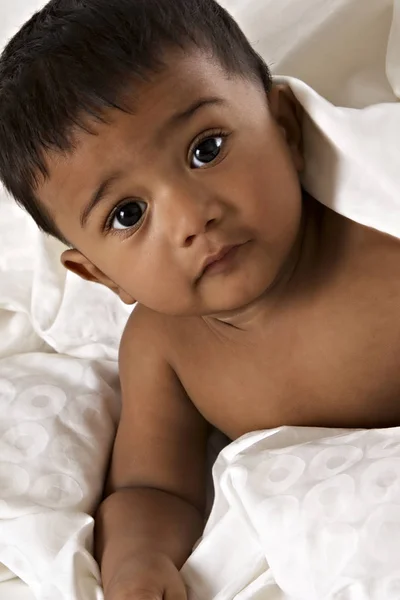 Sweet Indian baby lying on blanket — Stock Photo, Image