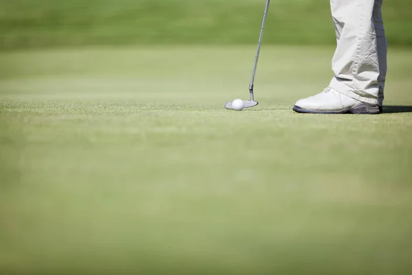 Macro of golf player putting. Stock Photo