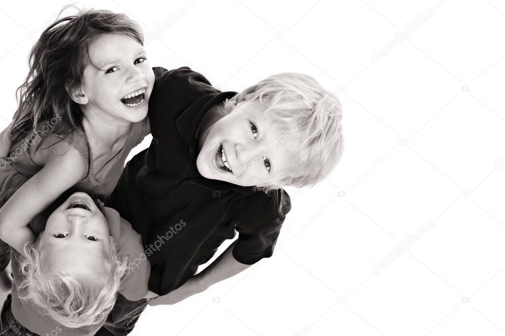Happy children laughing and looking up