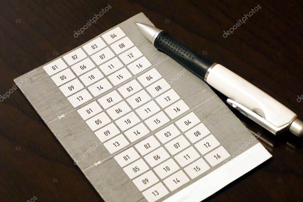 Prize drawing coupon form with a set of sixteen number with roller pen