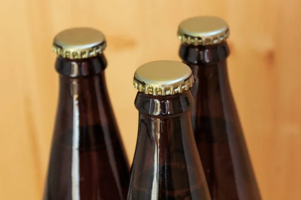 beer bottles, chilled drinks close-up, on wooden background